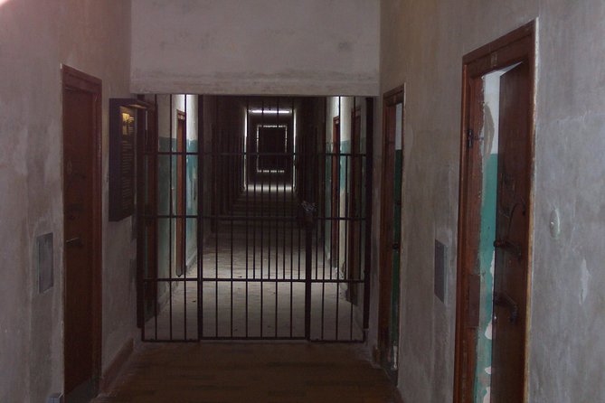 Dachau Concentration Camp Memorial Tour with Train from Munich - Inside the memorial: cells, barracks, and the gas chamber in context