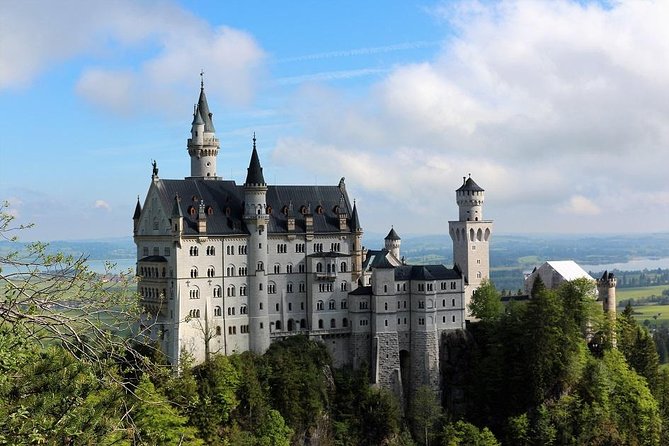 From Munich: Neuschwanstein Castle and Linderhof Private Tour - Oberammergau: Passion Play village character, with realistic lunch time